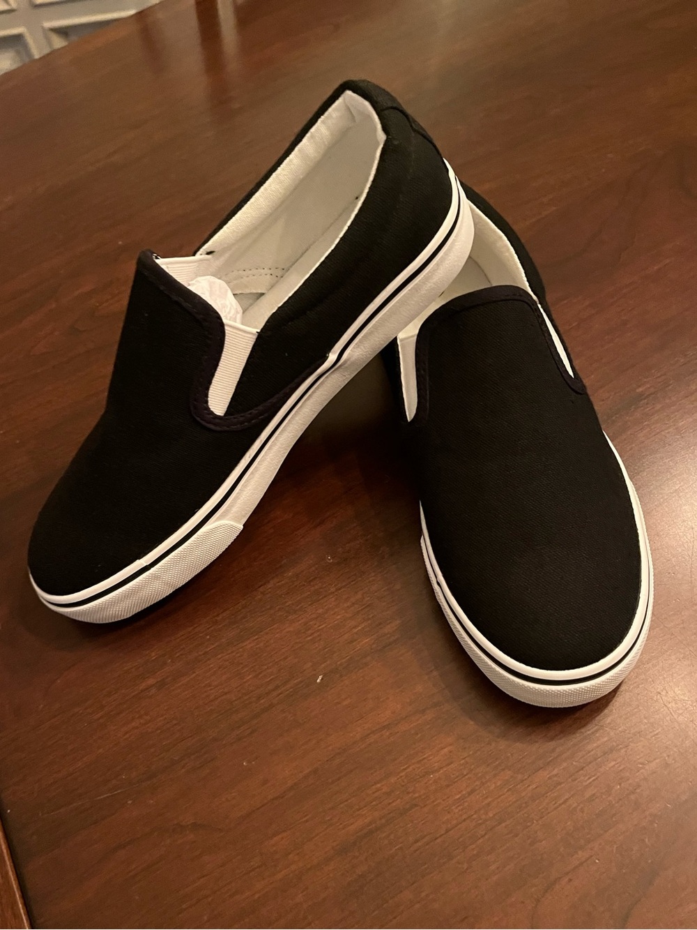 Black slip-on canvas sneakers